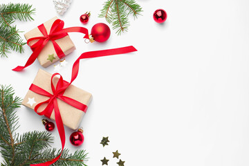 Fir tree branches, gift boxes and Christmas decor on white background, flat lay. Space for text