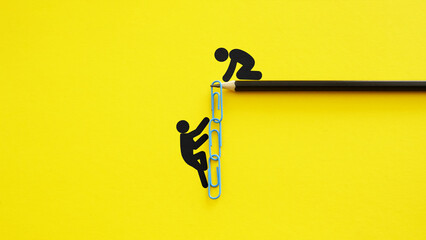 Mentorship and support metaphor with paperclip chain ladder on yellow background, teamwork and guidance concept