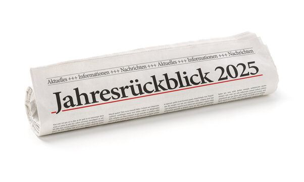 Zeitungsrolle mit der &Uuml;berschrift Jahresr&uuml;ckblick 2025