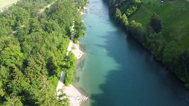 Drone footage of the Aar river in Switzerland, with a lot of people enjoying the current.
