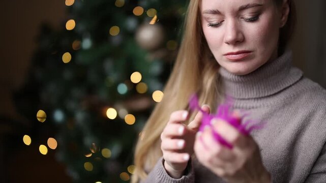 Stress management and mental health concept woman screams while playing with squishy toy indoors