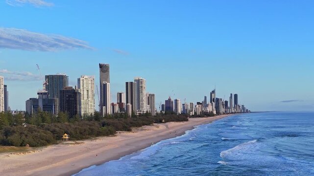 Drone flying in revers along the beach from broad beach to Mermaid