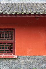 The traditional Chinese ancient-style building features red tiled houses
