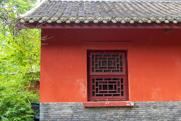 The traditional Chinese ancient-style building features red tiled houses