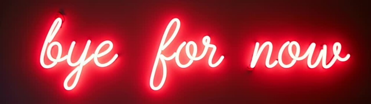 Neon sign with the word bye for now written in white
