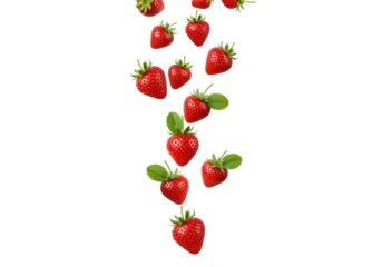 Fresh, vibrant strawberries cascade downward against a stark black backdrop, showcasing juicy red berries with lush green leaves.