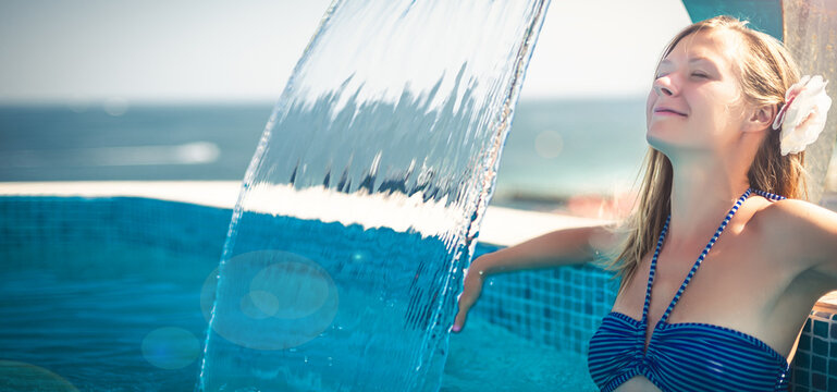Woman relaxing at the pool