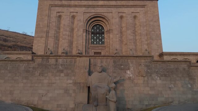 Aerial view of Mesrop Mashtots institute of ancient manuscripts. Drone view of the Matenadaran with a large arched entrance. Historical building. famous Armenian landmark, ideal for travel.