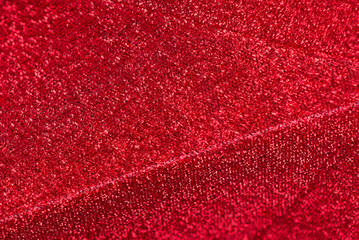 Red shiny blurred universal festive background. Brilliant colored sequins. Holiday greeting card. Happy holidays. Minimal, flat lay, copy space. Mockup