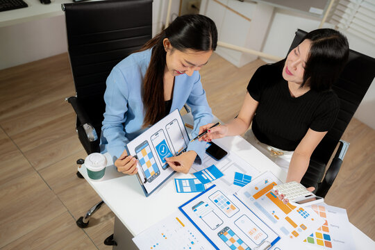 designer team coder or developer working using a computer display and smartphone in problem solving at workplace.