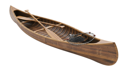 Wooden fishing canoe with paddles and net ready for a day on the water in a quiet, serene environment