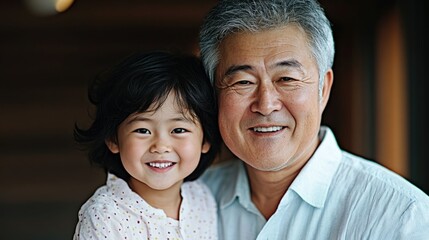Smiling Asian grandparent couple warmly observing their grandchildren playing and laughing with pure joy and happiness capturing the strong bond and affectionate relationship between the