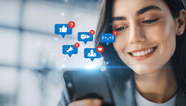 Person using smartphone with social media reaction icons floating above.
 - Powered by Adobe