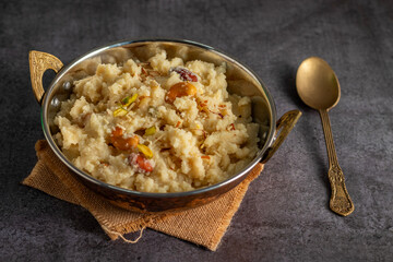 Suji ka halwa is a traditional Indian dessert made from semolina, ghee, sugar, and nuts, offering rich, sweet, aromatic flavor.
