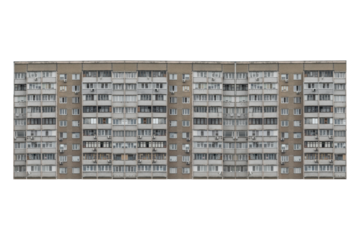 Nine storey apartment building facade with balconies is isolated.