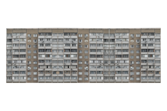Nine storey apartment building facade with balconies is isolated.