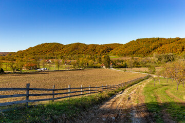 Fields and forests in a picturesque valley in Bosnia on a clear autumn day