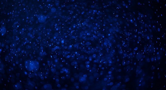 Vibrant blue abstract background with scattered glowing dots and soft bokeh circles, suitable for dynamic graphic design