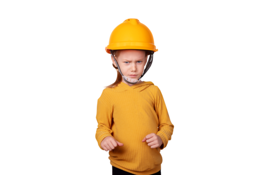 Young child in yellow safety helmet and sweater stands with a confident expression against a transparent background. Concept of safety, construction, and future careers.