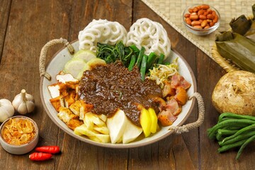 Rujak Cingur is a traditional dish typical of East Java, made from boiled cingur (cow's snout) and mixed with various kinds of fresh fruits, vegetables, lontong,tofu, tempeh