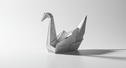 Monochrome origami swan isolated on white background, a symbol of peace and hope