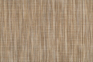 Natural rattan woven texture background. Brown wicker fabric pattern close-up