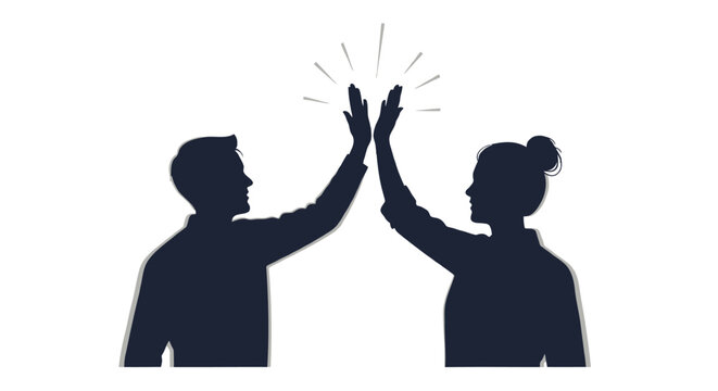 Two silhouetted figures a man and a woman giving each other a high five in celebration of success or teamwork