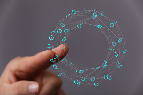 Abstract network sphere connected to human finger, representing digital interaction, connection, global network and technology. Data transfer an - Powered by Adobe
