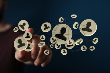 Human resources and data networking concept. Connected group of profile icons are hovered over by a finger, social connection.