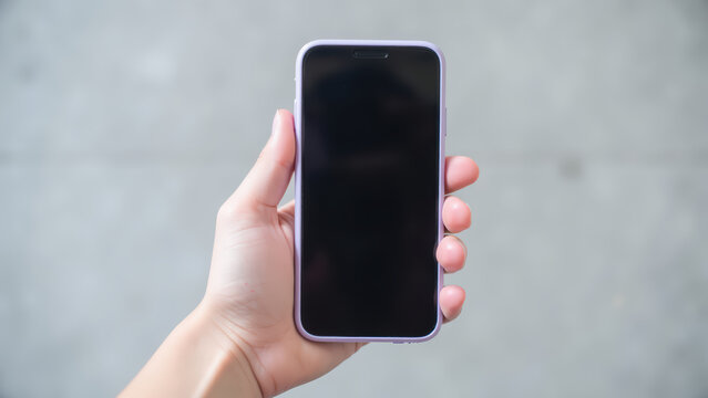 Person holds smartphone with blank screen, showcasing modern device in casual setting. image captures essence of technology and communication - Powered by Adobe