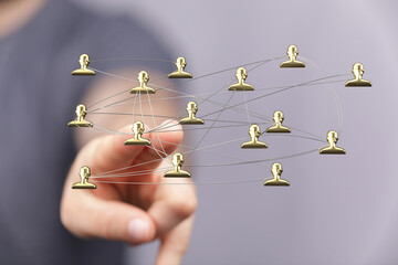 Symbolic image of a network, golden people representing community connections, teamwork, and digital interaction. Focus on collaboration, commun