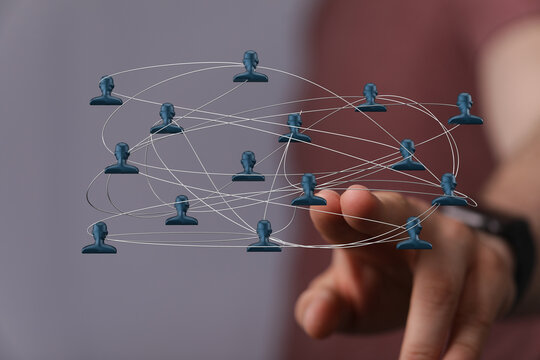 Abstract image representing a network of connections. Hand interacting with a network of people icons, symbolizing digital connectivity and team - Powered by Adobe