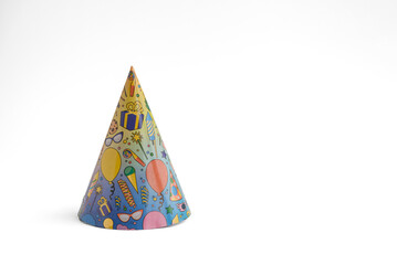 A colorful party hat with various festive designs, including balloons and confetti, set against a...