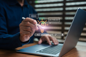 Businessman using digital pen on laptop with virtual AI assistant interface, representing artificial intelligence technology, innovation, automation, smart digital communication in modern business.