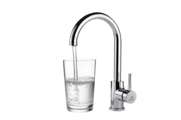 Chrome faucet filling a glass with water isolated on transparent background. Clear glass fills with fresh water from a stylish faucet isolated on white background.