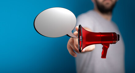 Person using a red megaphone with a speech bubble against a blue background, perfect for announcements and communication concepts.