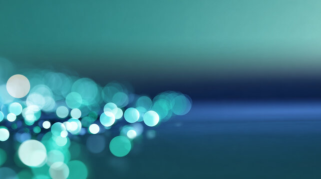 Abstract blue and teal bokeh lights with soft focus creating a dreamy and tranquil atmosphere on a smooth reflective surface