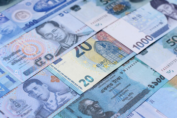 Money background, currency, paper banknotes from different countries. Money cash currency, blue