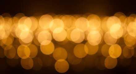 Abstract golden bokeh lights background with a soft focus effect, creating a warm and magical ambiance for festive occasions