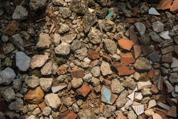 Top Down Construction Debris and Gravel Background with Broken Ceramic Shards