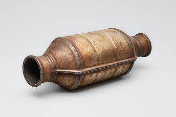 a used catalytic converter isolated on a white background. a device used in a vehicle's exhaust system to reduce toxic emissions. 
