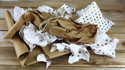  Recycled paper wrapped package on wooden surface, commercial eco photography with copy space. Minimalistic natural concept for sustainable product imagery