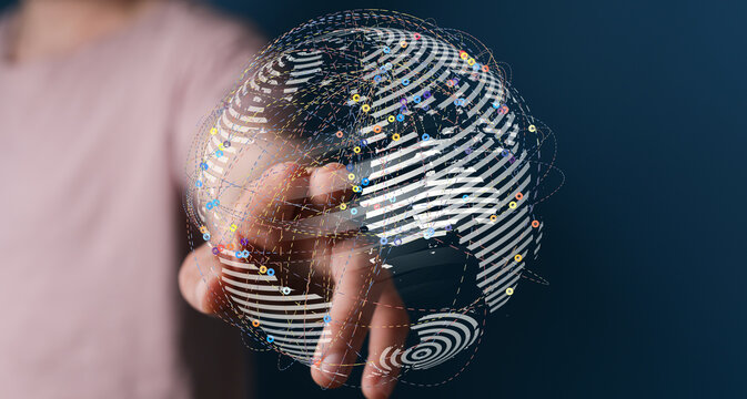 A person's hand touching a digital globe with network connections. Represents global communication, technology, and interconnectednes