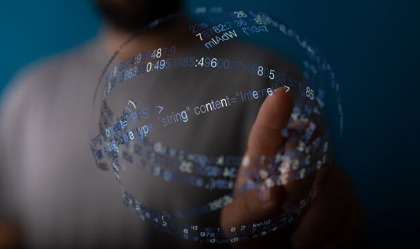 A person interacting with a sphere of digital code, representing technology, internet, and innovation. Conceptual image of data, codi