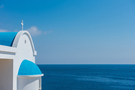 Traditional white chapel with a blue roof on the seaside. Agioi Anargyroi, Cyprus