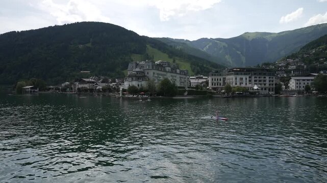 View of the Grand Hotel, town and lake from tour boat on Lake Zell on a sunny day, Zell am See, Salzburg, Pinzgau Region, Austria, Europe