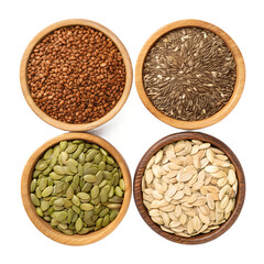 Assorted seeds in wooden bowls