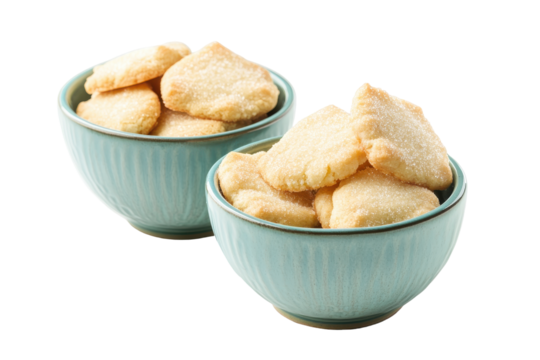 Bowls of light colored cookies isolated on transparent background. Delicious sweet biscuits piled high in two pastel bowls ready to eat isolated on white background.