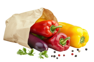 Fresh bell peppers spilling from a paper bag isolated on transparent background. Fresh ripe bell peppers spill from paper bag with herbs and peppercorns isolated on white background.