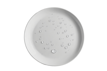 White ceramic plate with water droplets isolated on transparent background. Clean white ceramic plate with scattered water droplets isolated on white background.